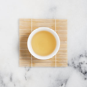 gui hua osmanthus green tea tea liquor in cup