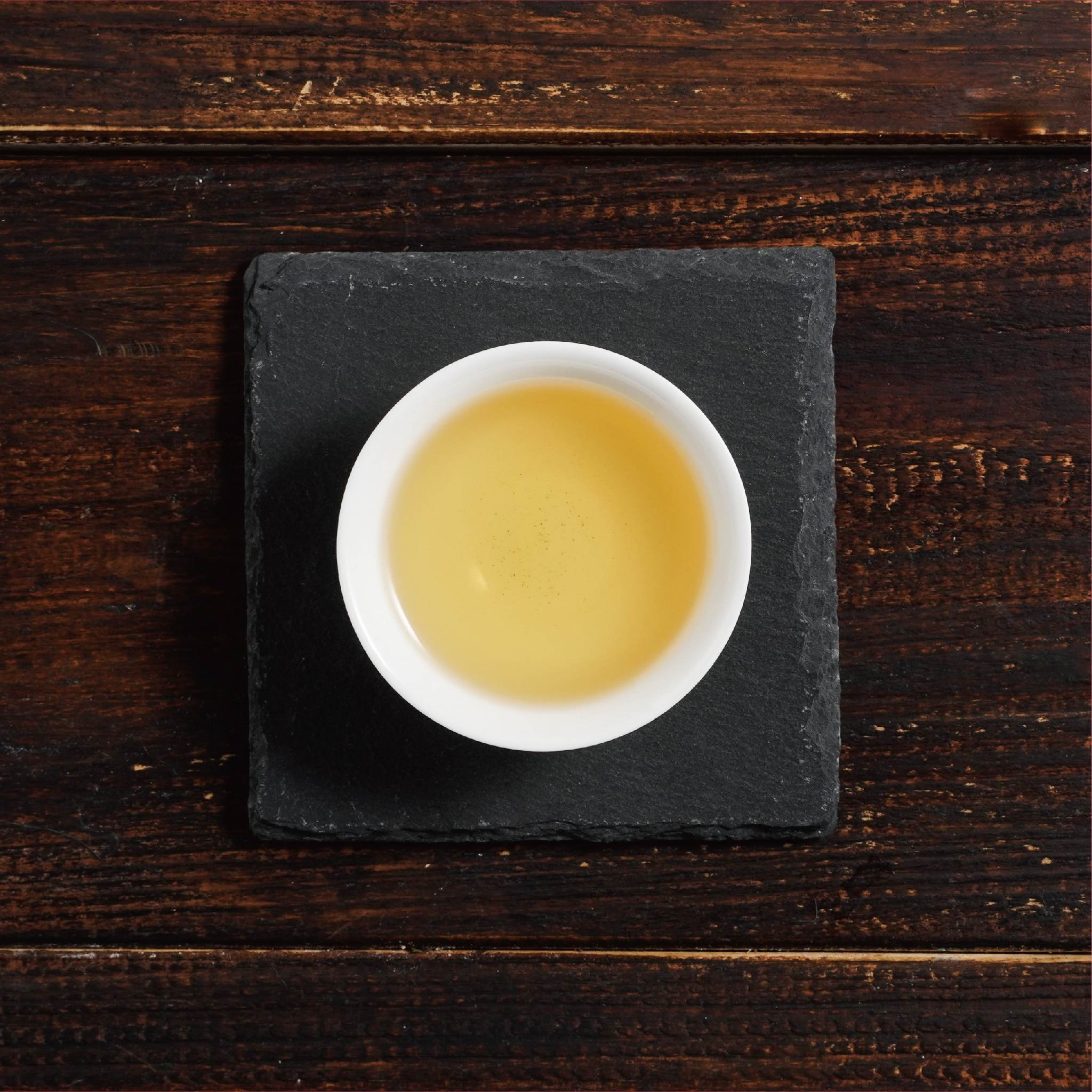 jin xuan golden daylily tea liquor in cup