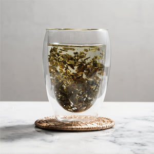 mo li hua jasmine green tea wet tea leaves floating in cup
