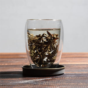 shui xian water sprite wet tea leaves floating in cup