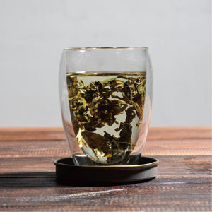 si ji chun four seasons spring wet tea leaves floating in cup
